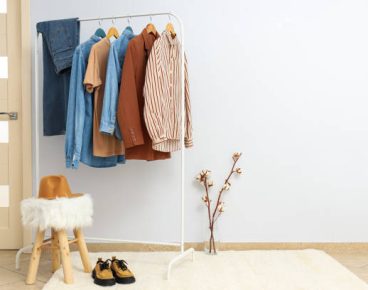 Wardrobe rack with different clothes, concept of different clothes